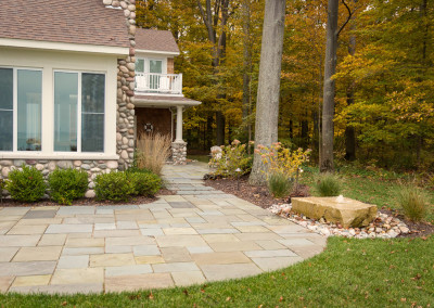 stone patio and water fountain