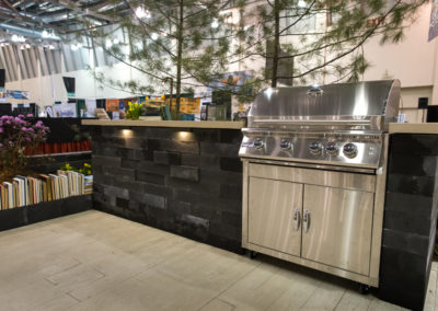 built in grill with concrete countertop