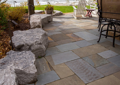 flagstone patio with boulder edging