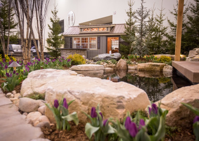 stone accents around backyard pond