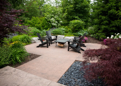 stamped concrete patio and boulder seating wall