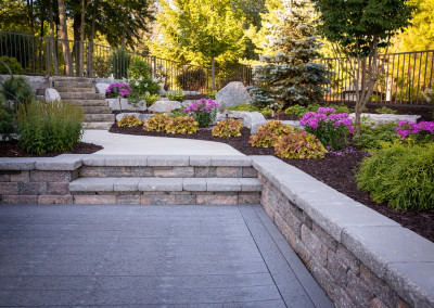 backyard patio with landscaping and stairs