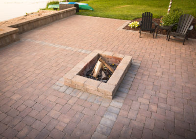 paver patio with built in firepit and seating wall