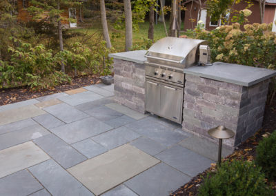 built in gas grill with concrete countertop