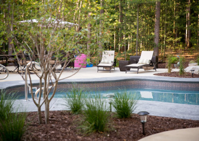 close up of pool patio with landscaping