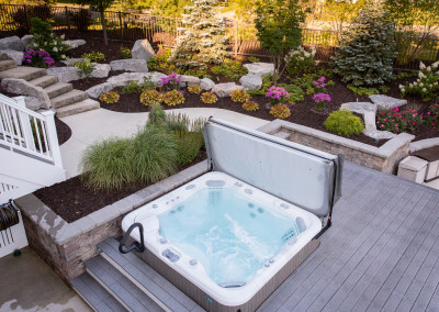 hot tub built into wood deck