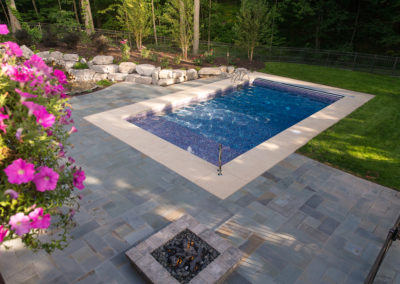 pool with blue stone patio