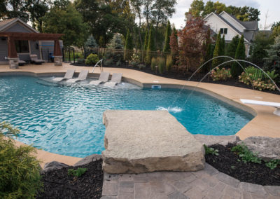 stone diving board and pool fountains