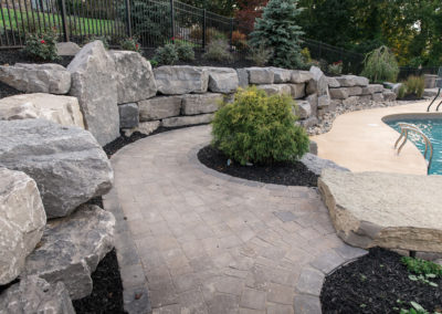 ada backyard entertaining with pool house, firepit and landscaping by essex outdoor design